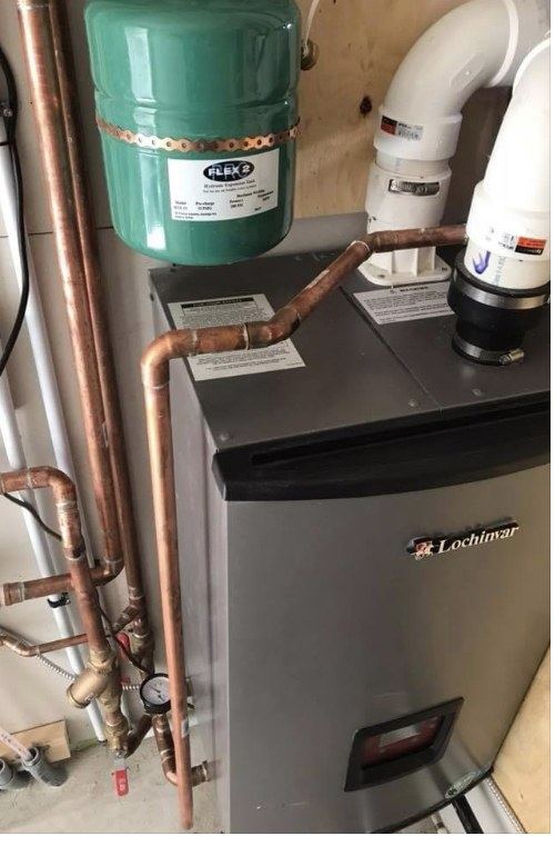 Lochinvar boiler with copper piping, expansion tank and white venting